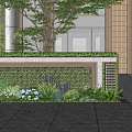 Modern Feature Wall with Green Plants Brick Structure and Trees Near Building Entrance