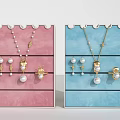 Elegant Jewelry Collection In Pink Blue Display Organizers With Necklaces Earrings Rings And Pearl Details