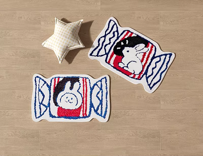 Cute Candy Shaped Rugs With Rabbit And Penguin Patterns Alongside Star Pillow On Wooden Floor 3d model
