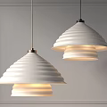 Two White Ribbed Pendant Lights Lit In Contemporary Gray Room Interior