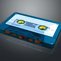 BASF Blue Cassette Tape Electronic Audio Storage Device With Yellow Reels And Orange Slots