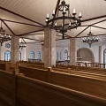 Religious Church Interior With Wooden Pews Red Carpet Aisle Altar And Stained Glass Windows