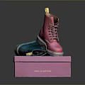 Pink Dr. Martens Boots On Pink Box With Blue Pair And Brand Logo
