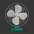 Silver Bladed Electric Fan With Green Base And Metal Guard On Dark Background