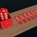 Red Decorative Tags With White Circular Patterns In Red Box On Wooden Table 3d model