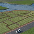 Scenic Waterfront Landscape With River Green Lawns Winding Walkways Road And White Cars
