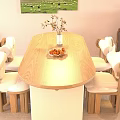 Oval Wooden Dining Table Set with Light Colored Chairs Upholstered Seats Vase Flowers Fruit Plate