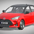 Red Toyota Hatchback With Black Roof UK License Plate And Alloy Wheels
