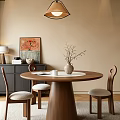 Round Wooden Dining Table Set with Three Gray Cushioned Chairs and Vase with Branches