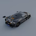Gray Aerodynamic Sports Car With Sleek Design Rear Wing And Alloy Wheels