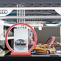Audi Exhibition Booth With Modern Design Showcasing Yellow Sports Cars
