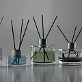 Perfume Cosmetics Transparent Glass Fragrance Bottles with Different Colored Liquids and Black Reeds