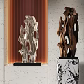 Abstract Modern Sculptures With Silver And Brown Carvings On Marble Bases Against Striped Wall
