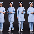 Group of Female Nurses in Blue Nursing Uniforms Holding Clipboards Standing Together