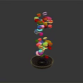 Colorful Floating Candy Balls Display on Black Base with Red Yellow Blue Hues