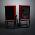 Pair of Red Wooden Audio Speakers With Black Stands And Front Panels