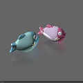 Blue And Pink Fish Shaped Toys With Star And Polka Dot Patterns And Eyes