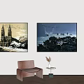 Stylish Interior Featuring Two Wall Paintings Brown Chair Side Table And Green Plant