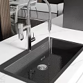 Modern Kitchen Black Sink With White Marble Countertop And Faucet Water Flow