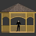 Yellow Hexagonal Gazebo Featuring Wooden Lattice Tiled Roof And Person Standing Inside Structure
