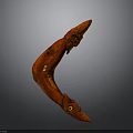 Red Curved Hand Carved Weapon With Carved Face And Eyes Details