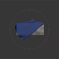 Patterned Blue Fabric Draped Over Metal Frame Table With Gray Top Surface