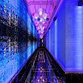 Glamorous KTV Corridor Interior With Blue Purple Lighting Chandeliers And Shiny Mirror Walls