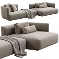 Modern Light Gray Sectional Sofa With Plush Cushions And Cozy Throw Blanket