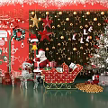 Christmas Floral Display with Red Background Golden Ornaments Santa Sleigh Gift Boxes and Christmas Tree