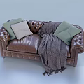 Brown Leather Double Sofa With Tufted Design Light Green Beige Pillows And Gray Throw Blanket