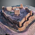 Ancient Circular Castle Ruins Featuring Stone Walls And Central Tower In Arid Landscape