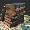 Stack of Various Colored Books With Different Thickness on Patterned Carpet