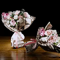 Beautiful Flower Bouquets With Pink Roses White Flowers Newspaper Wrapping Ribbon On Wooden Table