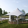 White Luxury Glamping Tent With Full Glass Walls And Cozy Outdoor Terrace On Green Meadow