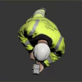 A Man In High Visibility Yellow Vest And White Hard Hat Using Smartphone