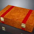 Decorative Orange Box With Red Straps Gold Metal Clasps And Textured Surface