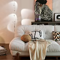 Modern Beige Two Seater Sofa With Decorative Pillows Floor Lamp Green Plant And Wall Art