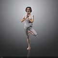 Woman Practicing Yoga Tree Pose With Hands In Prayer On Black Floor
