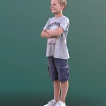 Man in Gray T-shirt and Blue Cargo Shorts Standing with Arms Crossed Against Green Background