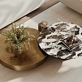Round Wooden And Marble Coffee Tables With Plant Decor In Living Room