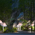 Mushroom Shaped Outdoor Lights Illuminating Garden With Bamboo Green Plants And Stones