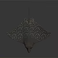 Spotted Stingray With Brown Body And White Dots Swimming Underwater