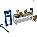 Industrial Equipment Setup Featuring Blue Hydraulic Jack Yellow Robotic Arm Workbench Tools And Column