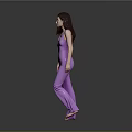 Full Length Woman In Purple Jumpsuit Standing Barefoot Against Gray Background