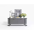 Gray Sideboard With Gold Handles Metal Base Table Lamp Photo Frame And Flower Bouquet