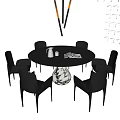 Modern Round Black Dining Table and Chairs Set with Decorative Vase and Magazine