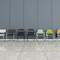 Modern Office Chairs With Various Colors And Wheels In Office Setting