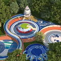 Colorful Outdoor Kids Playground With Slides Circular Areas Tower Structure And Green Trees
