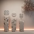 Decorative Ornament Combination on Textured Wall Featuring Carved Masks and Hollow-out Decorative Pieces