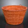 Adorable Kitten Resting In Round Orange Woven Basket With Handles